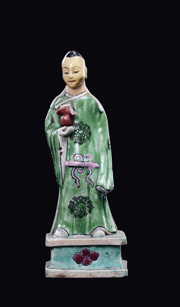 A polychrome porcelain dignitary figure, China, Qing Dynasty, 19th century