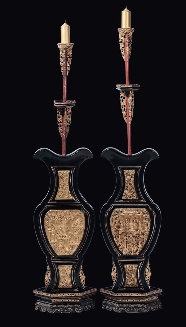 A pair of wood torches with gilt reserves, China, Qing Dynasty, 19th century