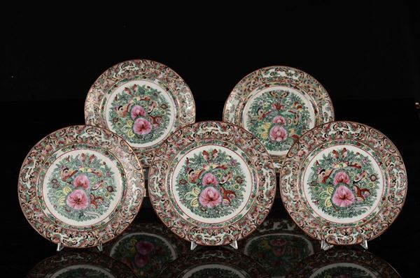Five polychrome porcelain dishes with a central lotus flower surrended by butterflies, China, Qing Dynasty. late 19th century