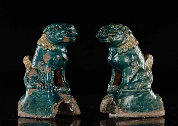A pair of porcelain Pho dog tiles in turquoise enamel, China, Ming Dynasty, 17th century