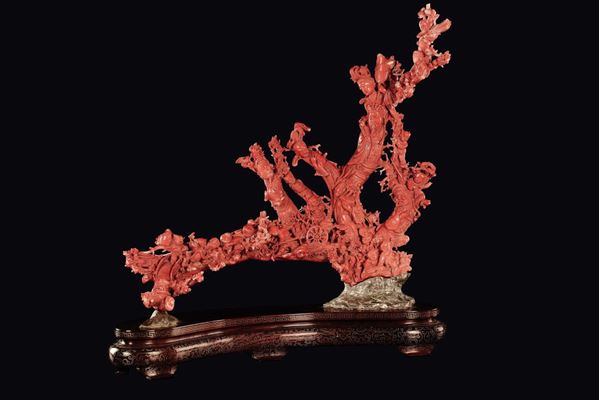 A carved coral group with dignitaries, Guanyin and playing children, China, Qing Dynasty, late 19th  [..]
