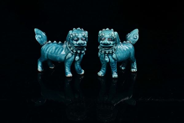A pair of turquoise glazed porcelain Pho dogs, China, Qing Dynasty, 19th century