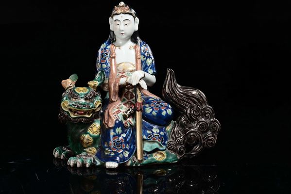 A Kutani porcelain dignitary on Pho dog, Japan, 19th century