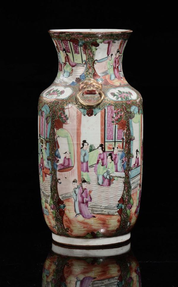 A polychrome porcelain Canton vase with court life scenes within reserves, China, Qing, Dynasty, 19th century