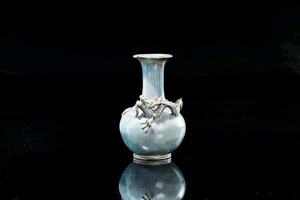A light blu glazed porcelain vase with dragon in relief, China, Qing Dynasty, 18th century
