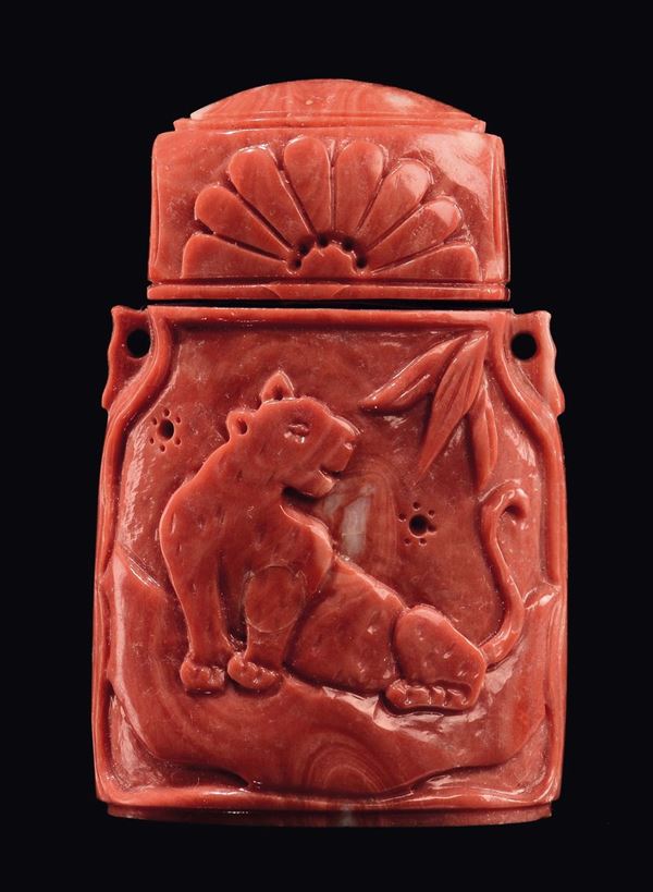 A carved coral snuff bottle with tiger, China, Qing Dynasty, late 19th century