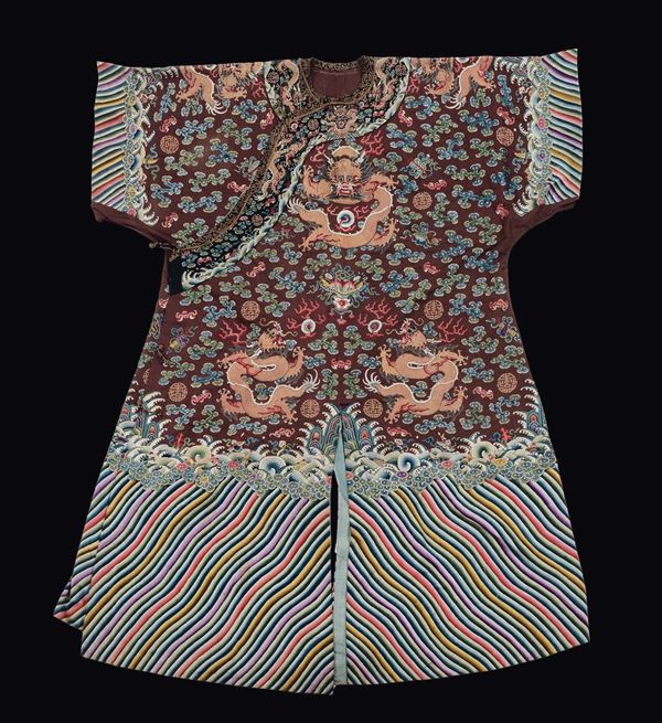 A silk dress red-ground embroidered with golden dragons, China, Qing Dynasty, late 19th century