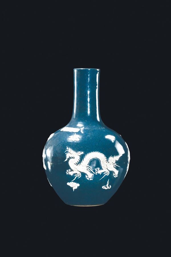 A deep blue ground porcelain vase with phoenix and dragon between clouds, China, Qing Dynasty, late 19th century