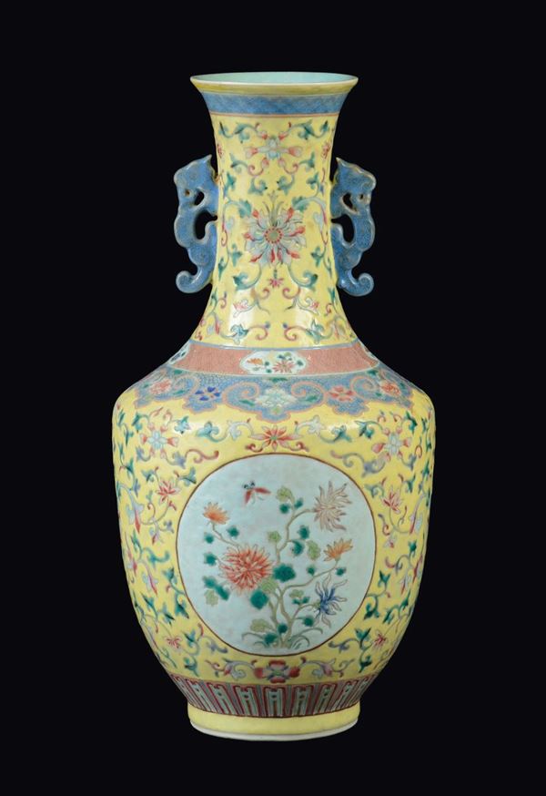 A Famille-Rose yellow-ground vase with flowers within reserves, China, Qing Dynasty, 19th century