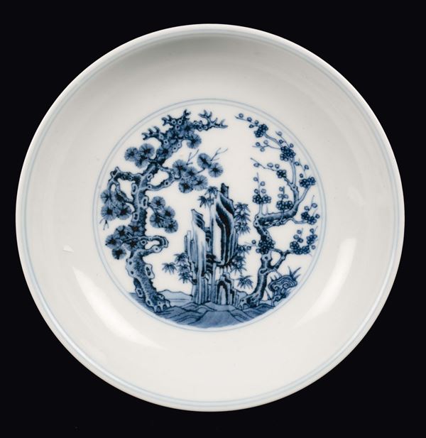 A blue and white dish with naturalistic decoration and common life scenes, China, Qing Dynasty, Qianlong Mark and Period (1736-1795)