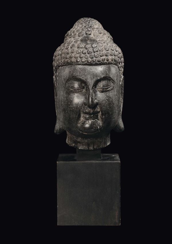 A basalt Buddha's head, China, Ming Dynasty, 17th century