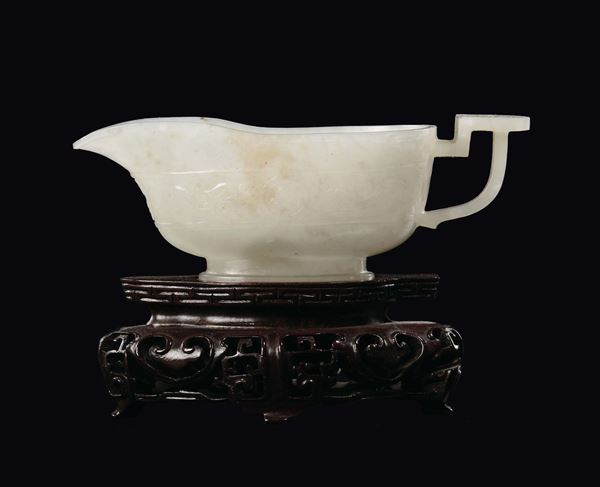 A white jade cup and handle with a geometric motif, China, Qing Dynasty, 18th century
