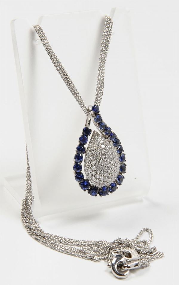 A diamond and sapphire pendant