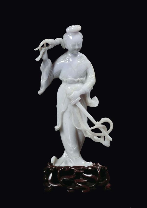 A pair of lavander jadeite Guanyin with a sword and ruyi, China, 20th century