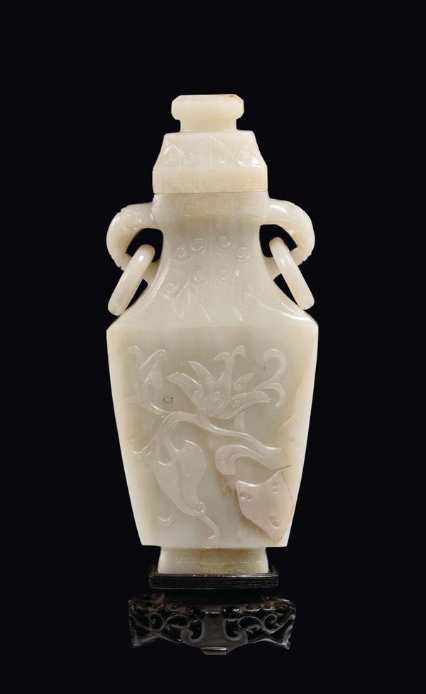 A white jade vase and cover with elephant-head double handles with rings, China, Qing Dynasty, 19th century
