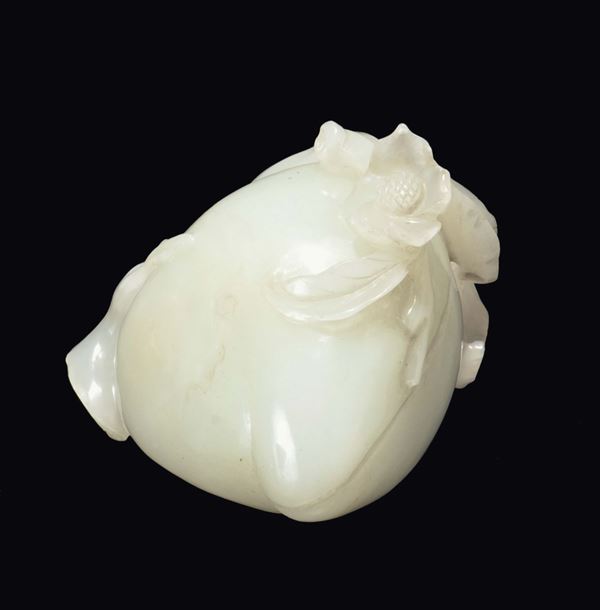 A white jade fig with a branch in relief, China, Qing Dynasty, 19th century
