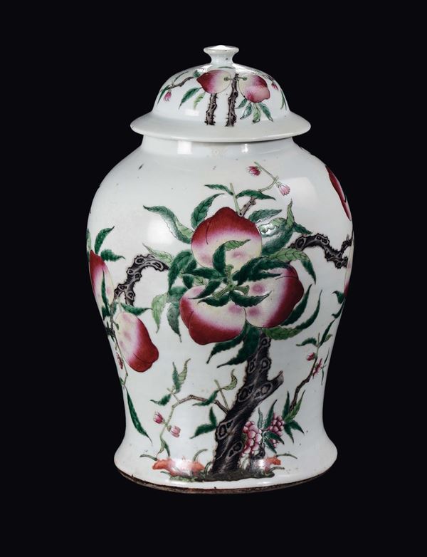 A polychrome enamelled porcelain potiche and cover with peaches, China, Qing Dynasty, 19th century