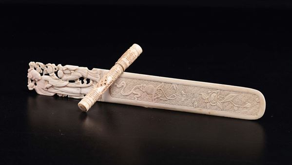 A carved ivory paper knife and a bone fan holder, China, early 20th century