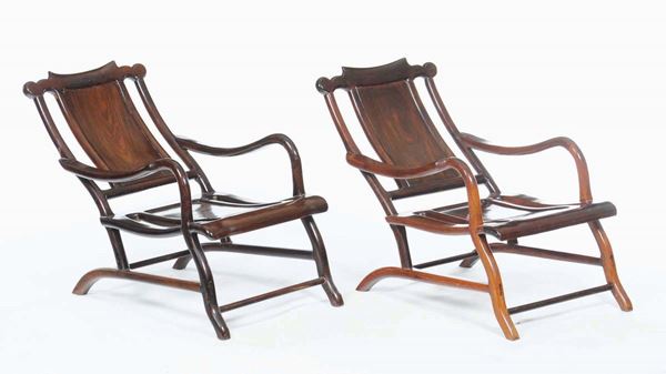 A pair of carved wooden armchairs, China, Qing Dynasty, 19th century