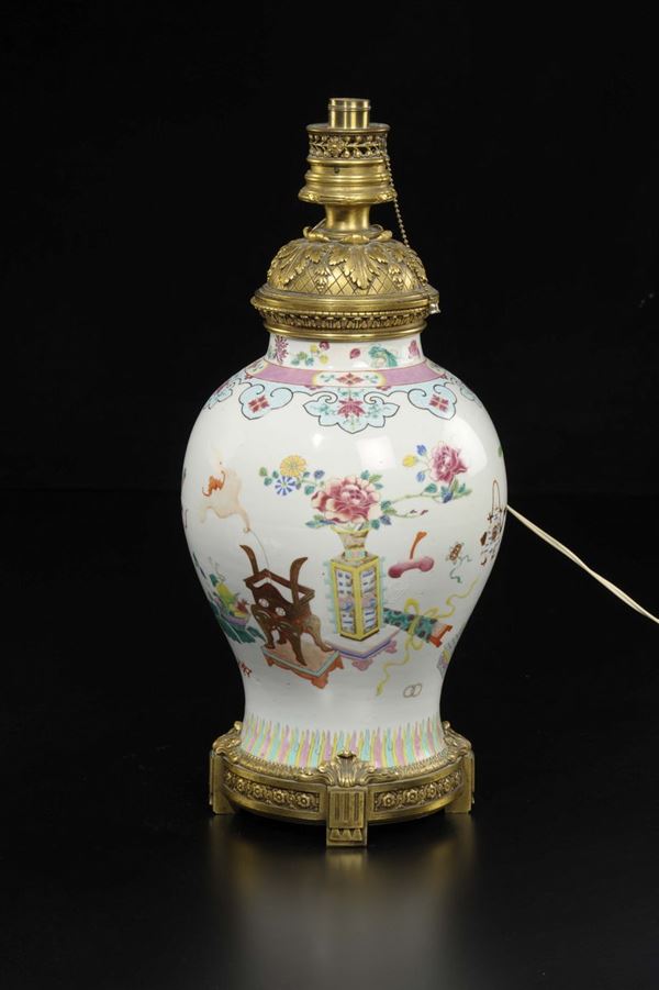 A polychrome enamelled porcelain vase with naturalistic decorations and gilt bronze details, China, Qing Dynasty, 18th century