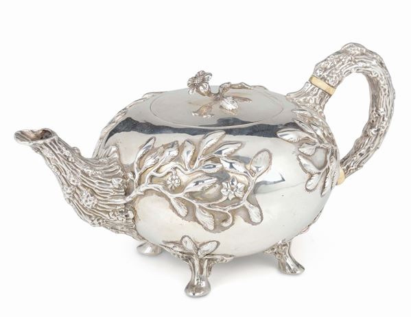 An embossed, molten and chiselled silver tea-pot, silversmith Charles Jolie Edington, London 1829