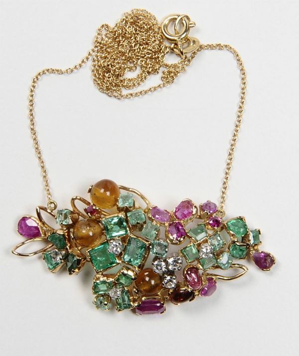 A gem-set and gold pendant
