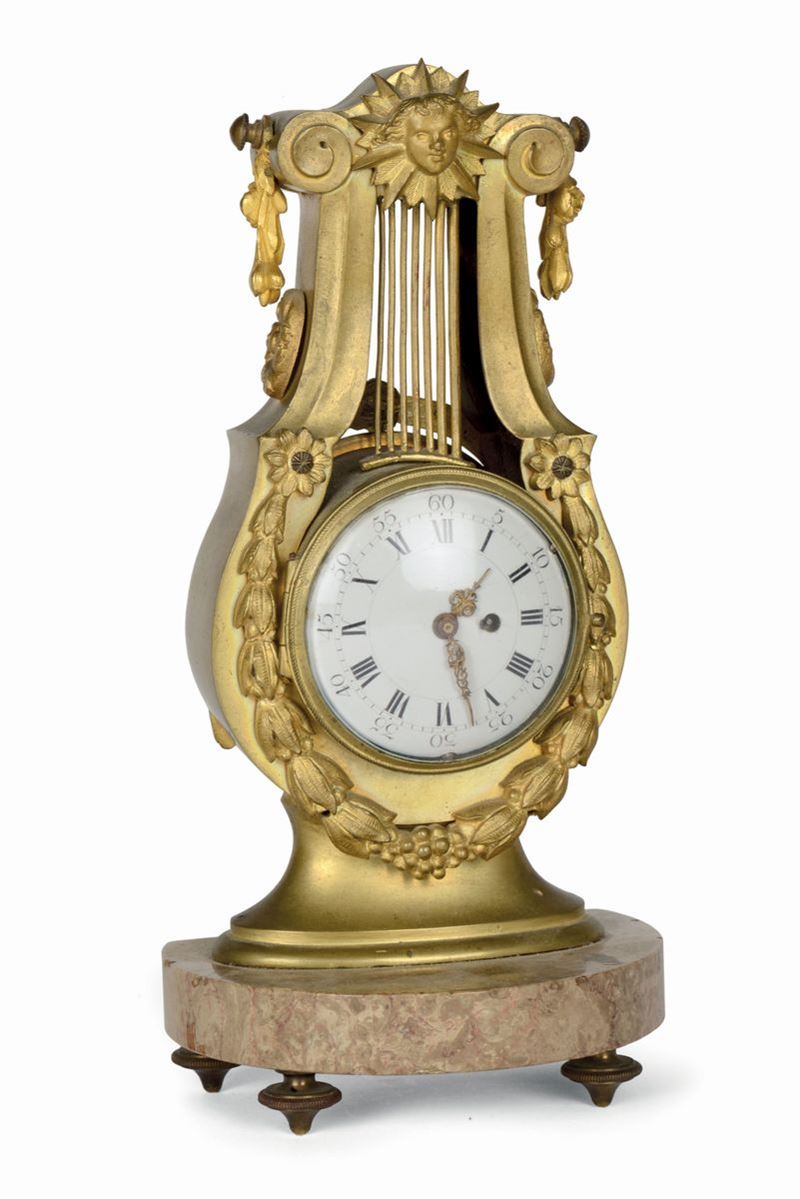 Orologio Impero in bronzo dorato a lira, Francia XIX secolo  - Asta Antiquariato e Dipinti Antichi - I - Cambi Casa d'Aste