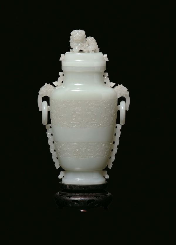 A large and important white jade vase and cover with Pho dogs carved with a geometric motif in archaic  [..]