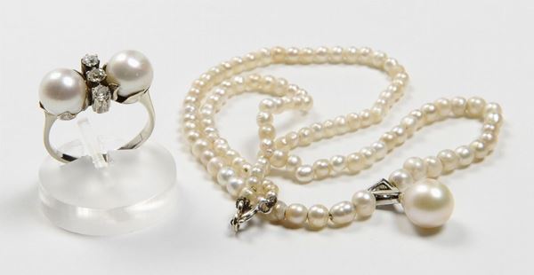 A natural pearl necklace, a diamond and cutured pearl ring