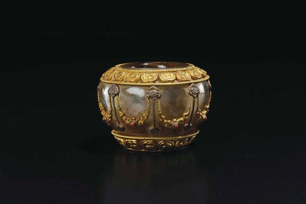 A smoky rock crystal and gilt bronze vase with hardstone inlays, Tibet, late 19th century