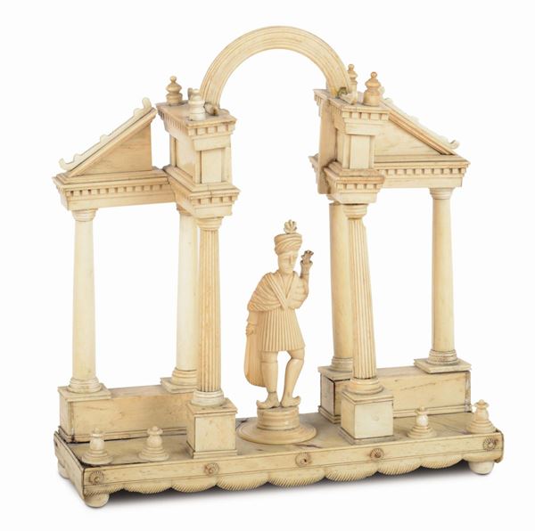 An ivory architectonic model in the shape of a temple, in the centre an oriental-dressed male figure, Colonial art, probably India 19th century