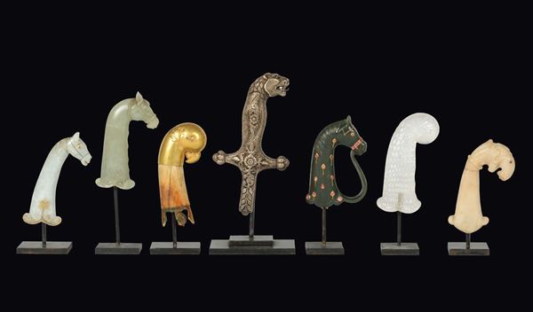 A lot of seven dagger handles made of jade, ivory, silver and marble shaped as animal heads, Mogul, from 18th to 20th century