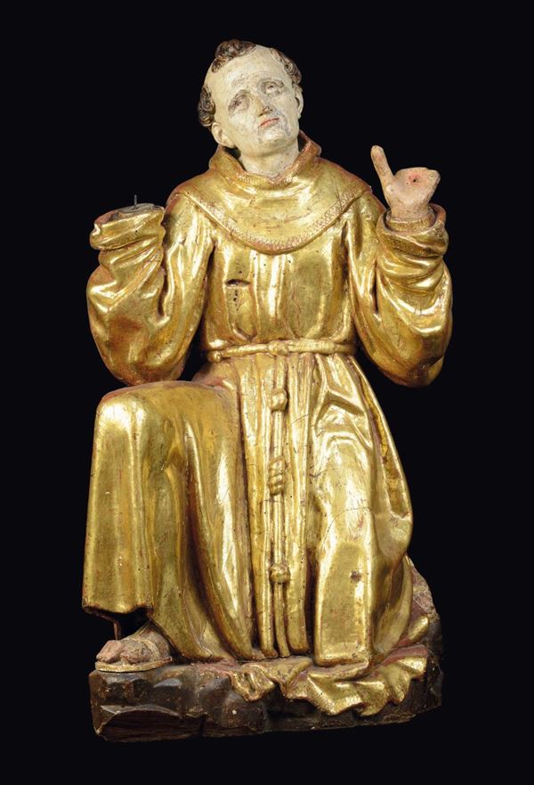 A polychrome and gilt wood St Frances receiving the stigmata sculpture, Spanish sculptor, 16th century