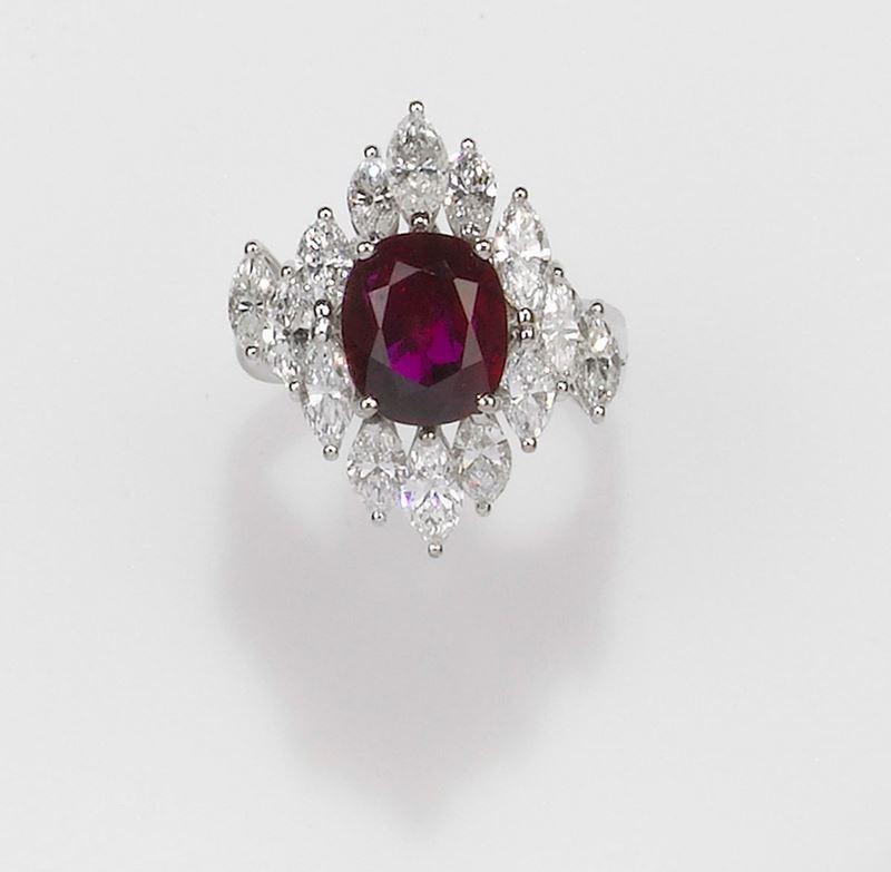 A ruby and diamond ring. Centring on an oval ruby weighing 4,00 carats. Accompanied by IGI report n° 37420, stating that the ruby is natural, Thailand origin, with no indications of heating  - Auction Fine Jewels - II - Cambi Casa d'Aste