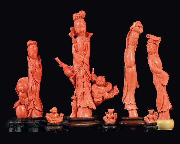 A lot of carved coral sculptures, four figures of Guanyin, three child and a branch with little birds, China, early 20th century