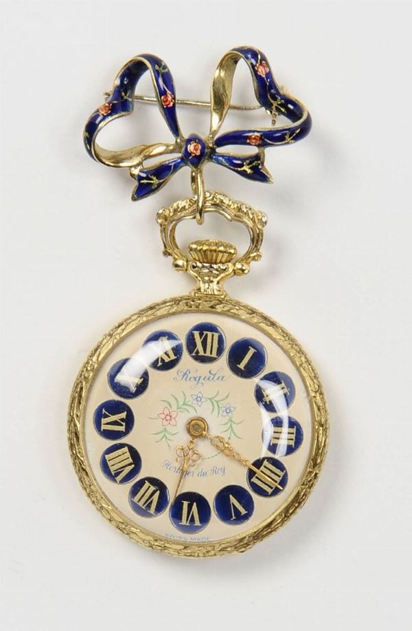 A gold and enamel poket watch with brooch
