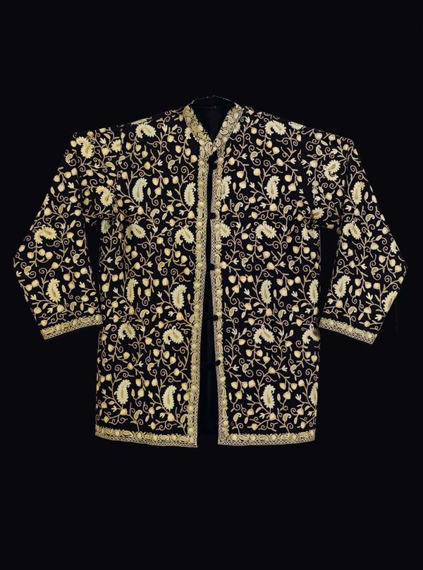 A silk black-ground coat embroidered with golden leaves, China, early 20th century
