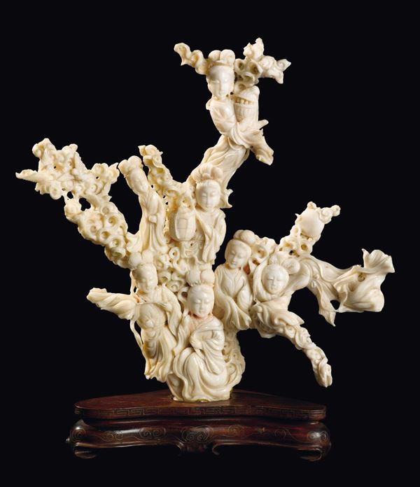 A large carved white coral seven Guanyin with vases and birds group, China, early 20th century
