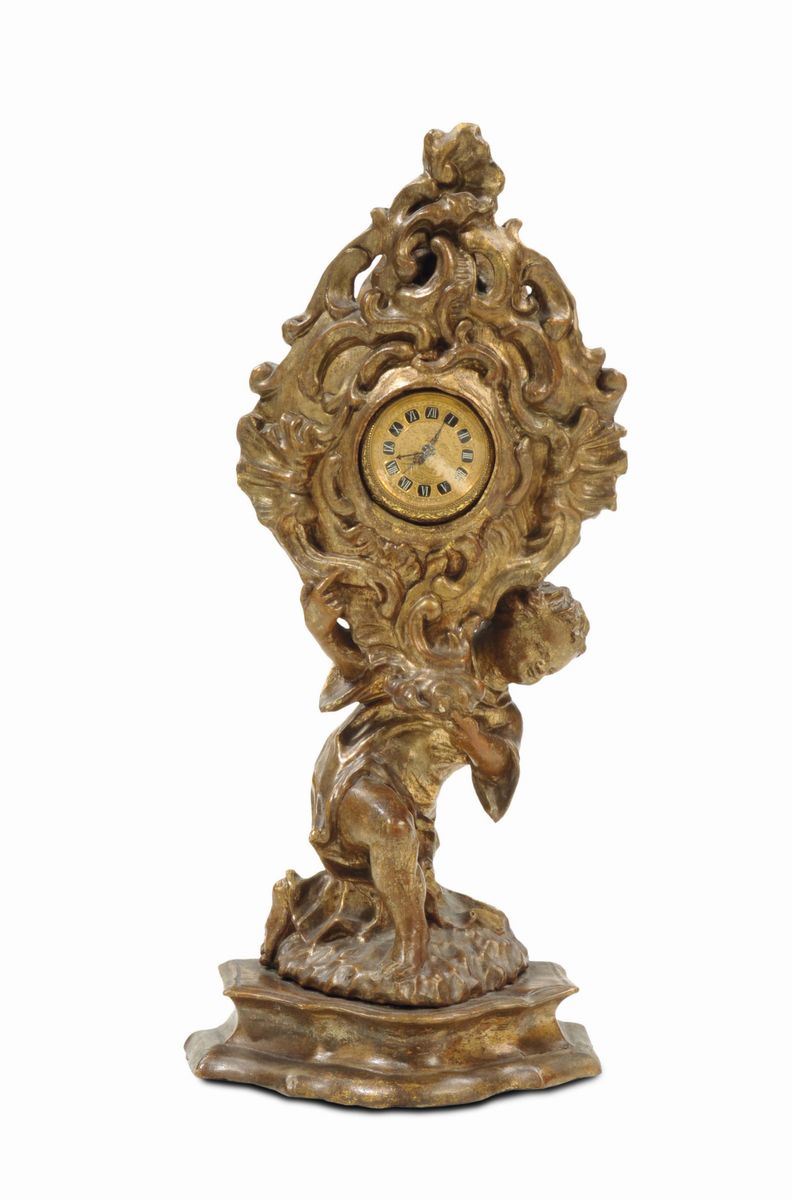 Porta orologio in legno intagliato e dorato a mecca, XVIII secolo  - Asta Arredi dalle dimore degli eredi Ercole Marelli e altre provenienze - Cambi Casa d'Aste