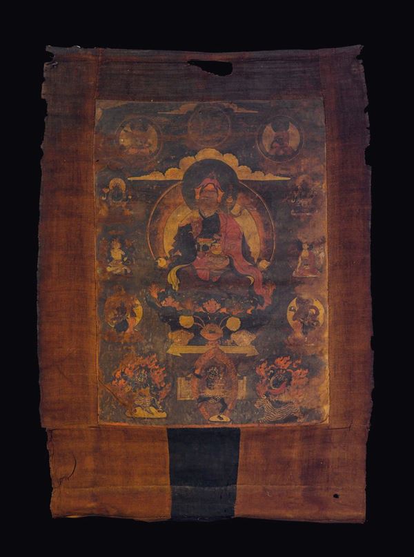 A brown-ground tanka with thirteen deities, Tibet, 17th century