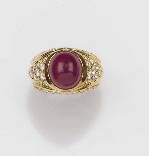 A cabochon ruby and diamond ring