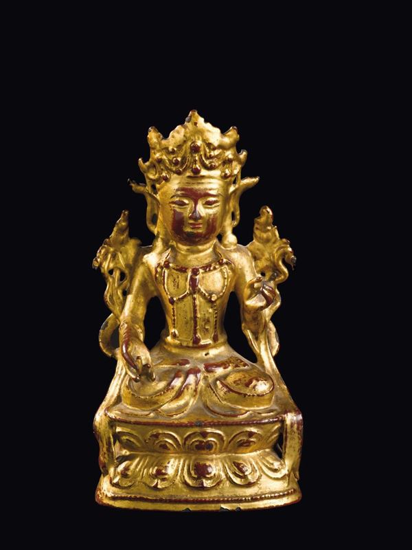 A cold gilt bronze seated Buddha on a double lotus flower, China, Ming Dynasty, 17th century