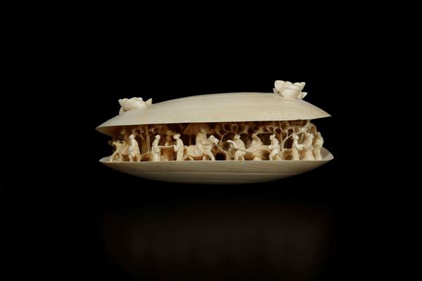 A carved ivory shell depicting common life scenes, China, early 20th century