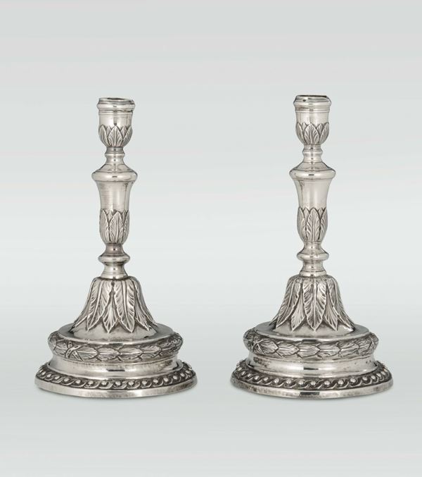 A pair of Louis XVI embossed silver candlesticks, Genoa, late 18th century
