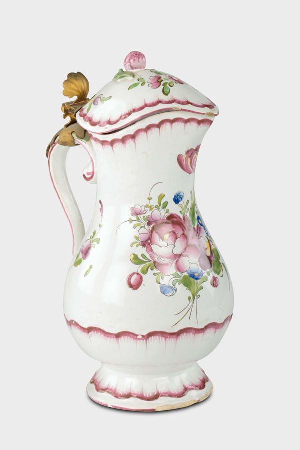 A polychrome majolica ewer and cover with rose decoration, France, late 18th century