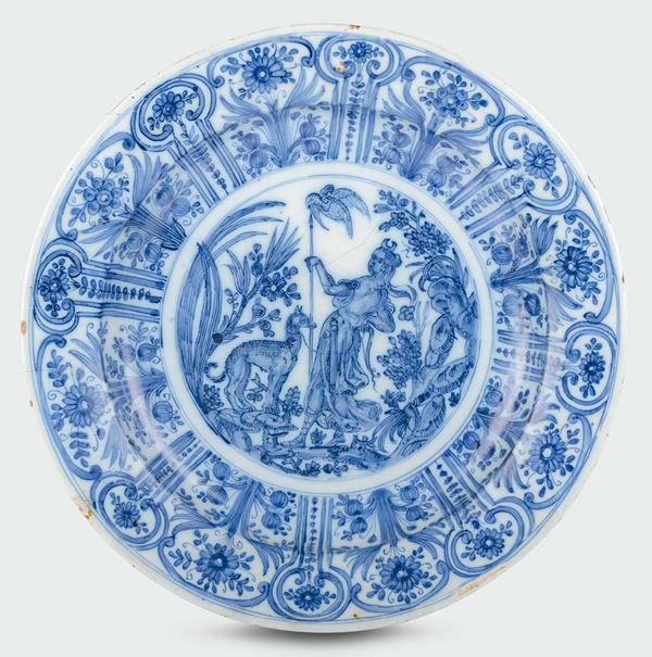 A majolica plate with white and blue “naturalistic calligraphic” decoration, fish mark, Pescio manufacture, Albisola, late 17th century