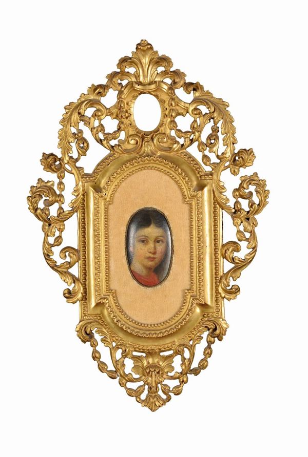 A small mould frame with carved and gilt wood decorations, late 18th century