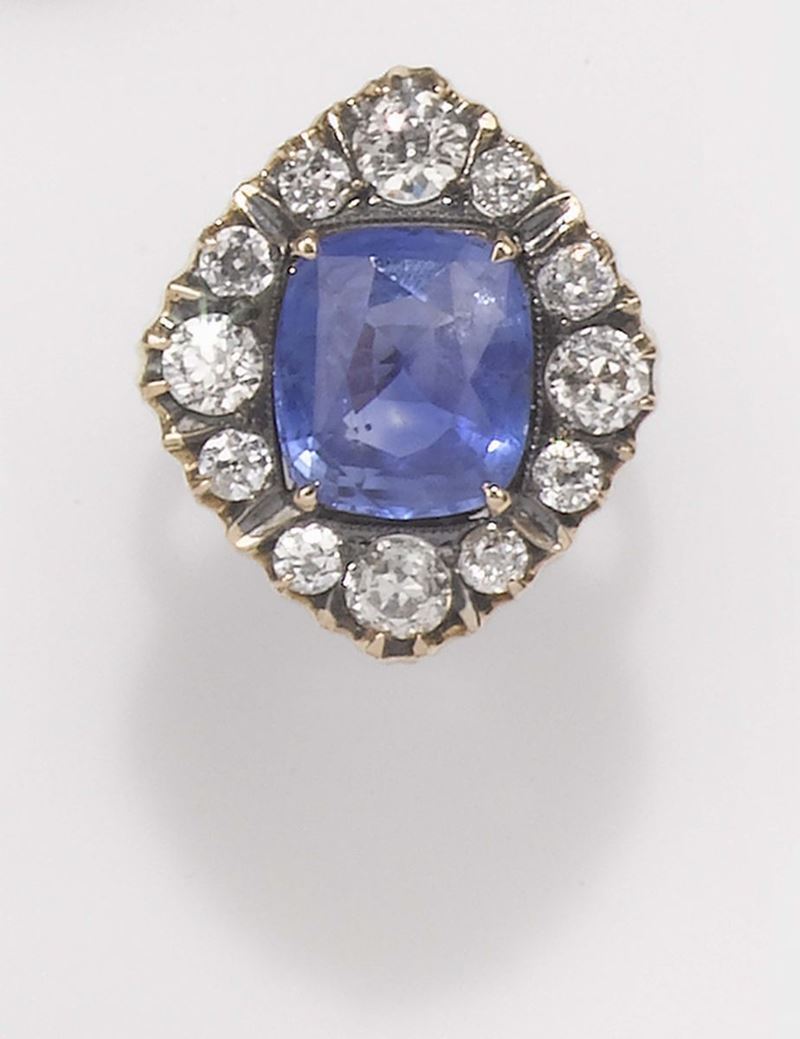 A sapphire and old cut diamond ring. The sapphire from Sri Lanka weighing 6,80 carats. Gemmological Report R.A.G n° CR1004/15  - Auction Fine Jewels - II - Cambi Casa d'Aste