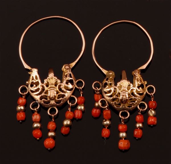 A pair of coral and gold pendent earrings