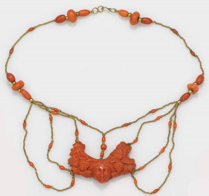 A 19th century coral carving, 1840 circa. A maenad (bacchante) gold and coral mount  - Auction Jewels - II - Cambi Casa d'Aste